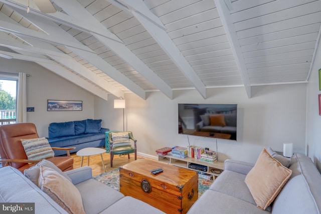 living room featuring wood-type flooring and vaulted ceiling with beams