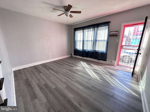 spare room featuring hardwood / wood-style floors and ceiling fan