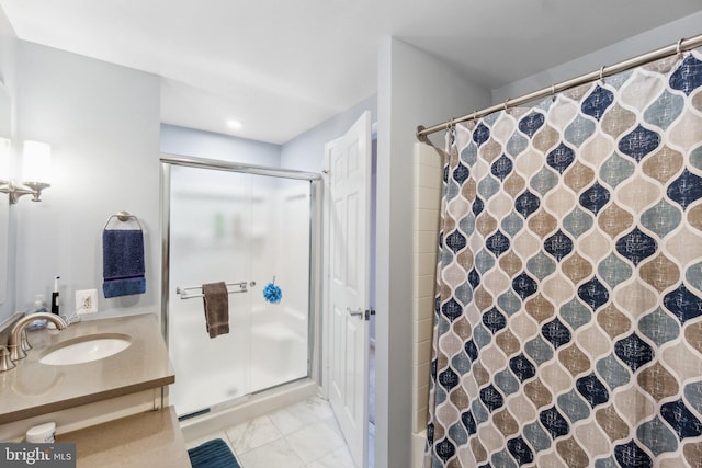 bathroom with vanity and walk in shower