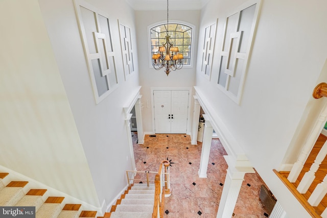 foyer entrance with an inviting chandelier