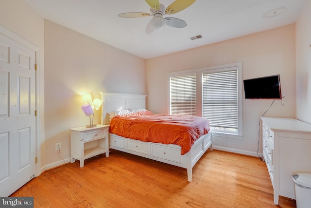 bedroom with ceiling fan and light wood-type flooring