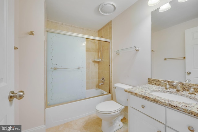 full bathroom featuring tile patterned flooring, vanity, toilet, and enclosed tub / shower combo