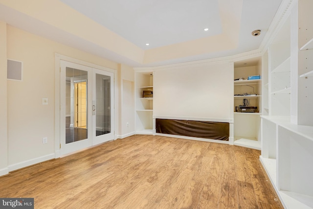 spare room with french doors and wood-type flooring