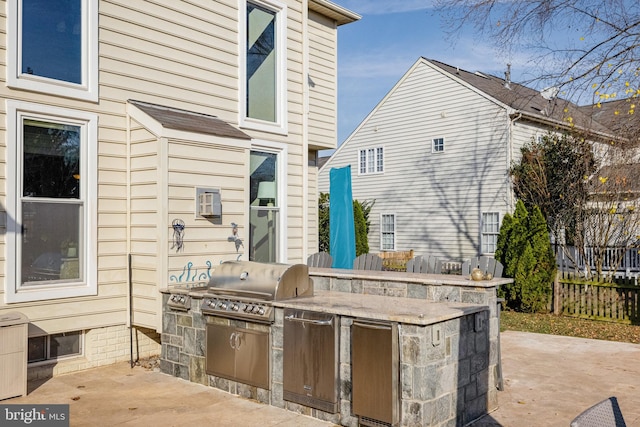 view of patio / terrace with grilling area and an outdoor kitchen