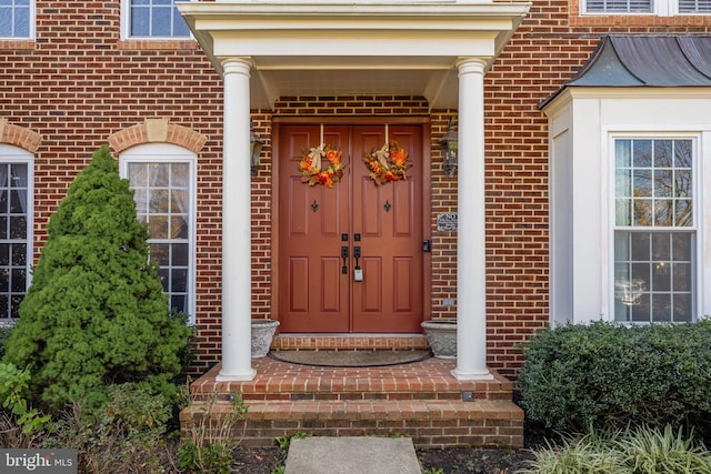 doorway to property featuring covered porch