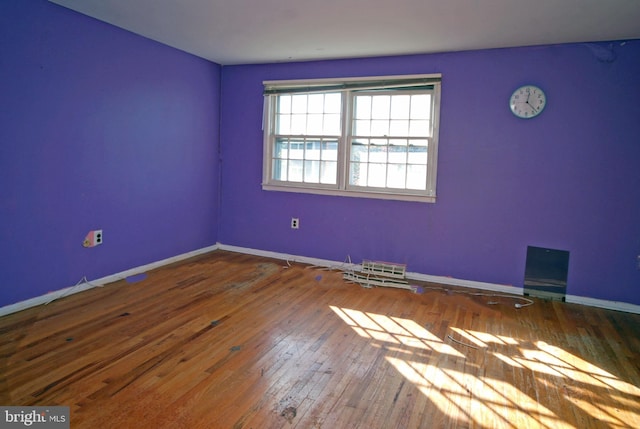 empty room featuring wood-type flooring