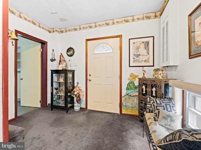 view of carpeted entrance foyer