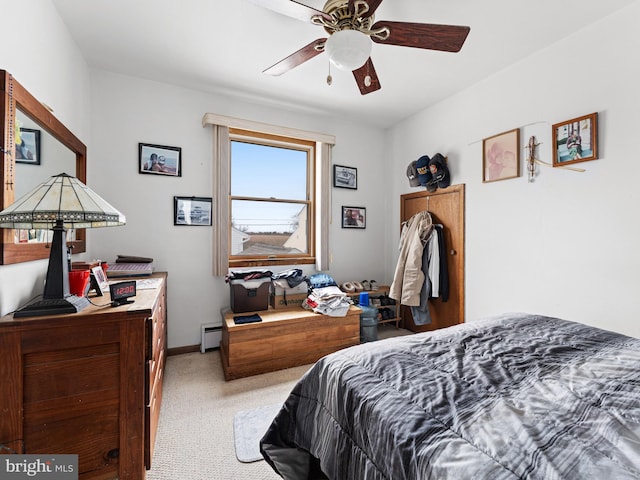 bedroom with baseboard heating, ceiling fan, and light carpet