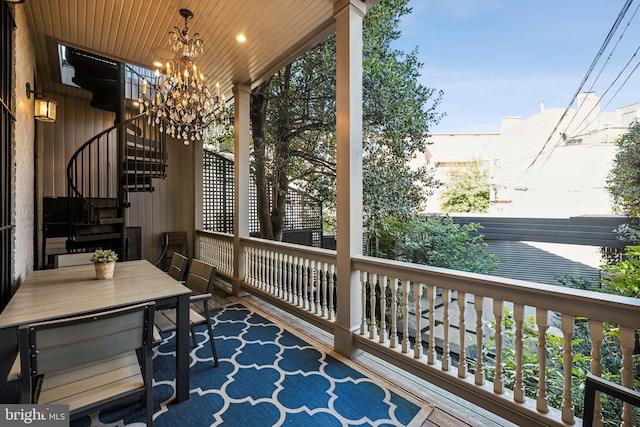 exterior space with a healthy amount of sunlight, wooden ceiling, vaulted ceiling, and a notable chandelier