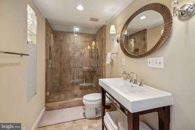 bathroom with toilet, an enclosed shower, and crown molding