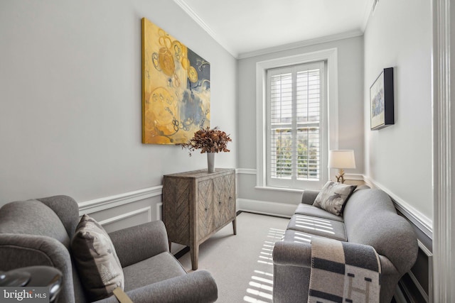 living area featuring crown molding and light colored carpet