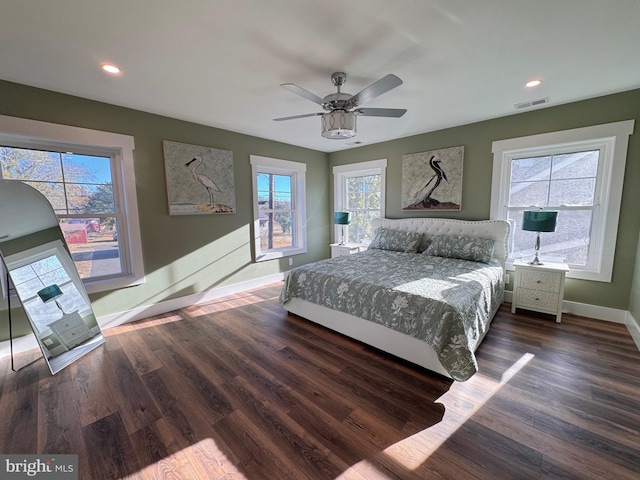 bedroom featuring dark wood-type flooring and ceiling fan