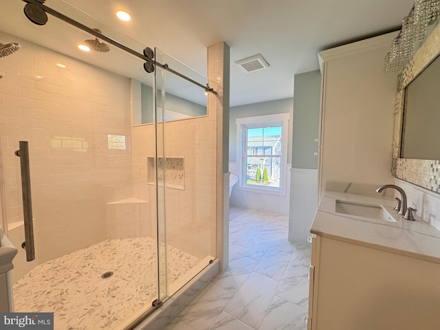 bathroom featuring vanity, separate shower and tub, and tile walls