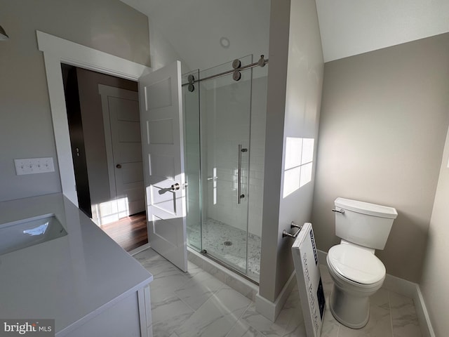 bathroom with toilet, vaulted ceiling, and a shower with shower door