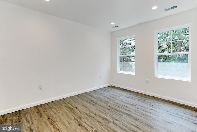 empty room with light hardwood / wood-style floors