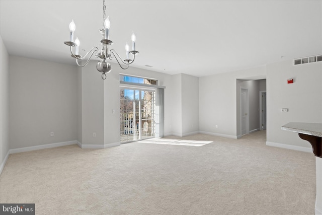 3000 Fountainview Cir Unit 201, Newark, DE 19713 - unfurnished dining area featuring a chandelier, light carpet, and baseboards