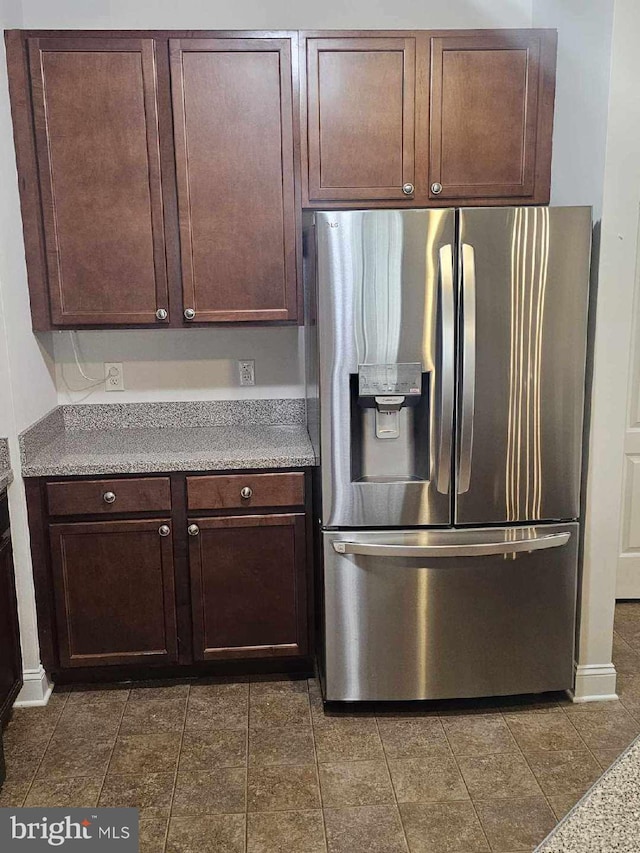3000 Fountainview Cir Unit 201, Newark, DE 19713 - kitchen with stainless steel fridge, dark brown cabinetry, and light countertops