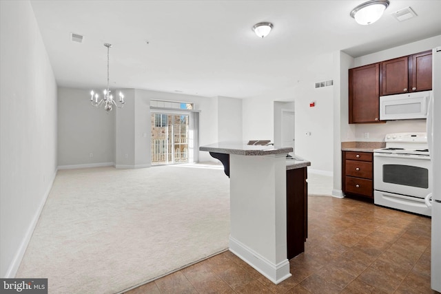 kitchen with a notable chandelier, dark carpet, a kitchen breakfast bar, pendant lighting, and white appliances