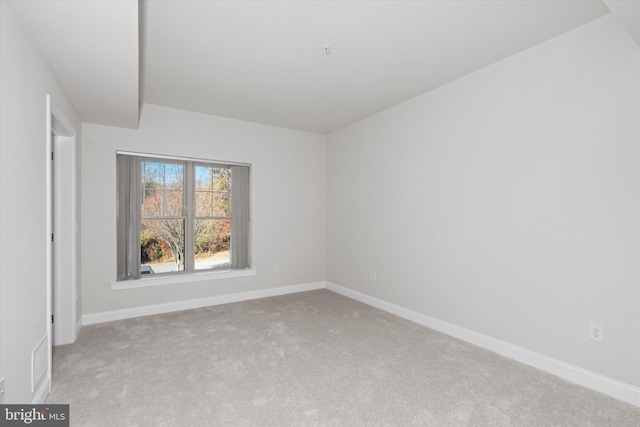 empty room with light colored carpet