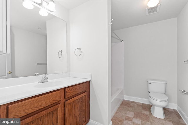 full bathroom featuring  shower combination, vanity, and toilet