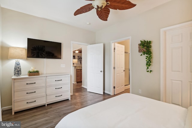 bedroom with dark hardwood / wood-style flooring, connected bathroom, and ceiling fan