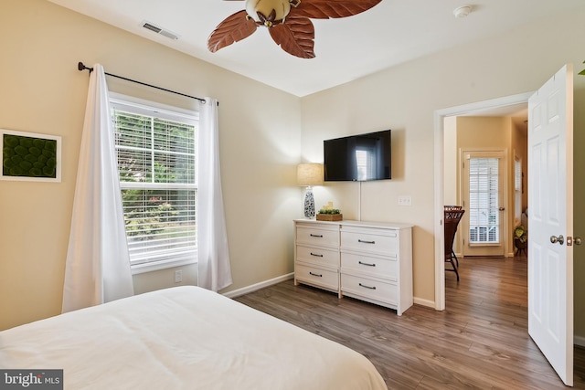 bedroom featuring ceiling fan and dark hardwood / wood-style flooring