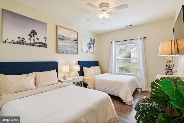 bedroom featuring hardwood / wood-style floors and ceiling fan