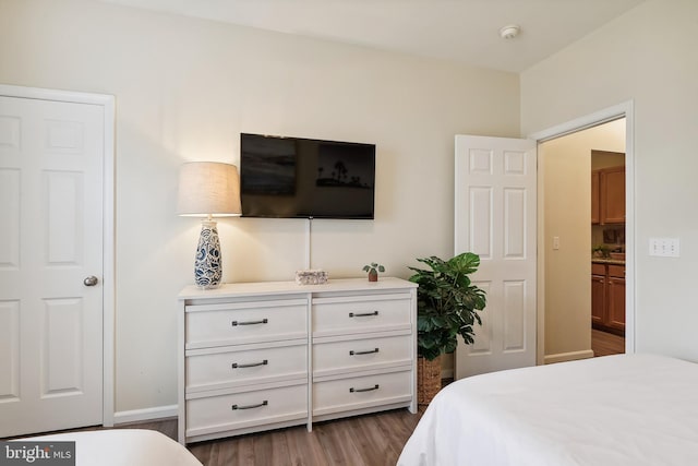 bedroom featuring dark wood-type flooring