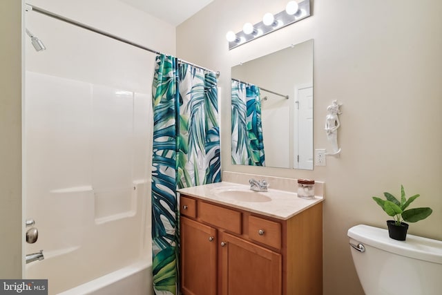 full bathroom featuring vanity, toilet, and shower / tub combo with curtain