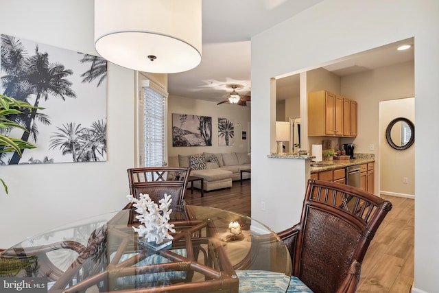 dining room featuring ceiling fan and wood-type flooring