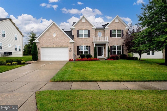 view of front of home featuring a garage and a front lawn