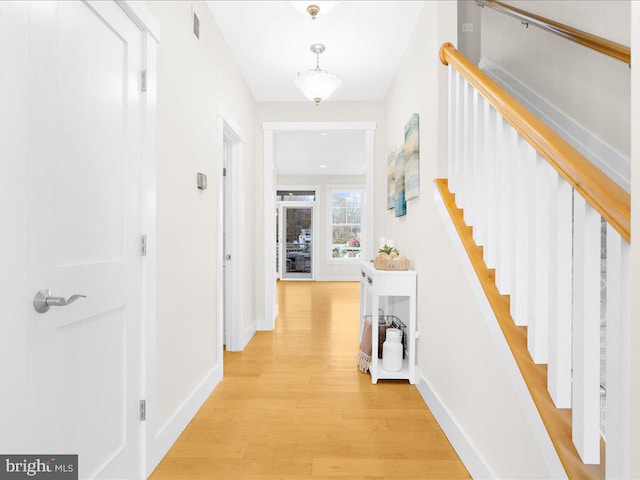 corridor featuring light hardwood / wood-style floors