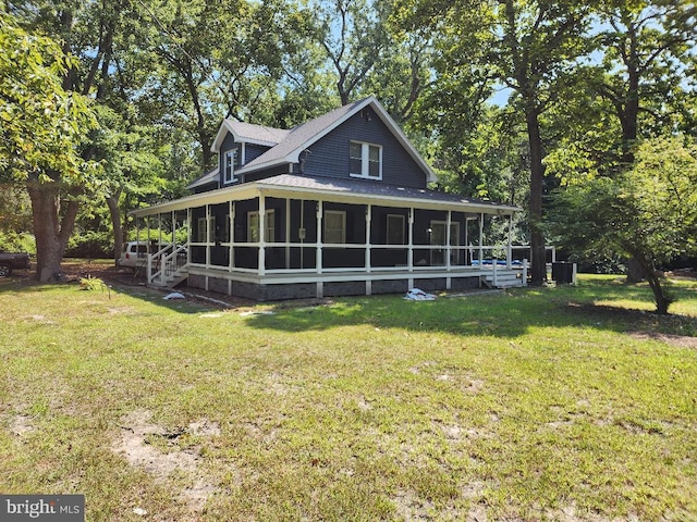 exterior space with a lawn and a sunroom