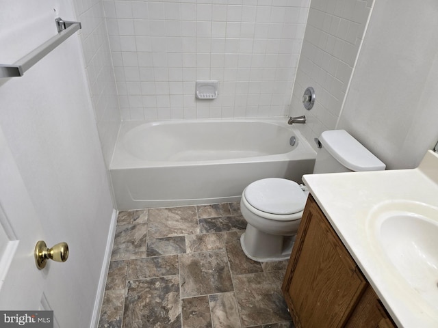 full bathroom with vanity, toilet, and tiled shower / bath