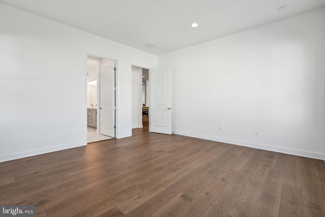 empty room featuring dark hardwood / wood-style floors