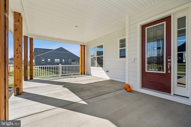 wooden deck featuring covered porch