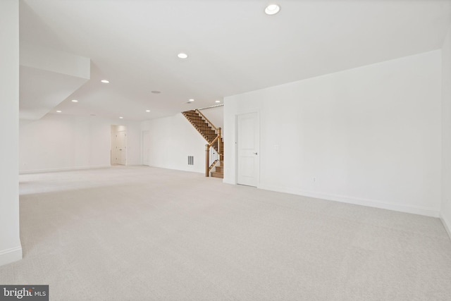 bonus room featuring light colored carpet