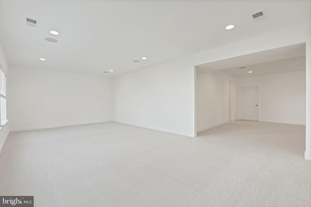 spare room with light colored carpet