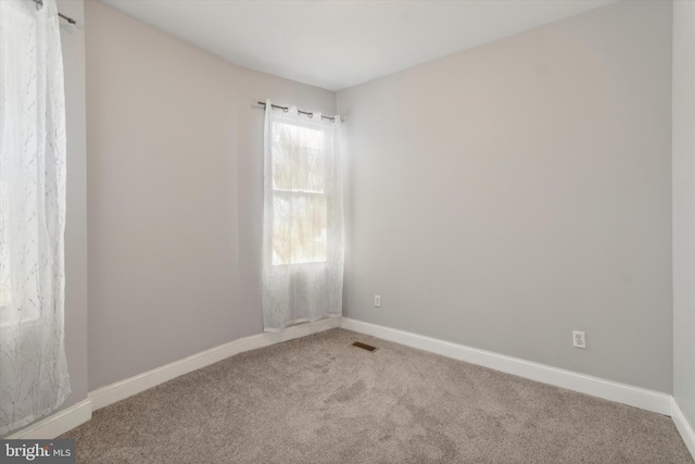 empty room featuring carpet flooring