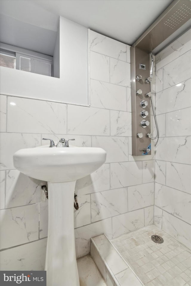 bathroom with tiled shower