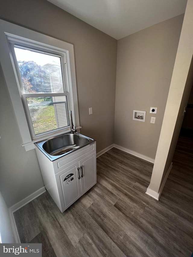 laundry area featuring dark wood-type flooring, hookup for a washing machine, sink, and hookup for an electric dryer