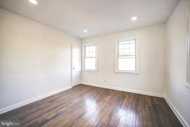 unfurnished room featuring dark hardwood / wood-style floors