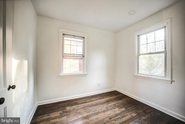 empty room featuring dark hardwood / wood-style floors