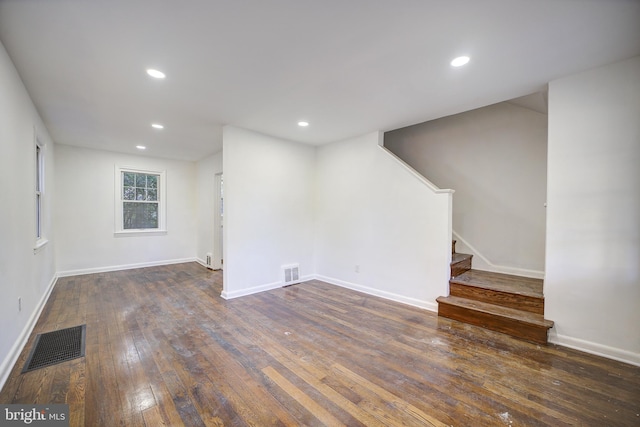 basement with dark hardwood / wood-style flooring