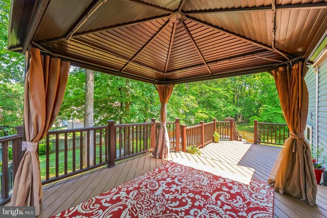 wooden deck featuring a gazebo