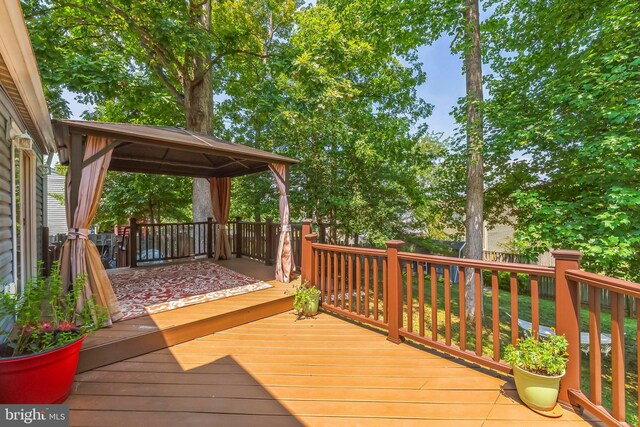 wooden terrace with a gazebo