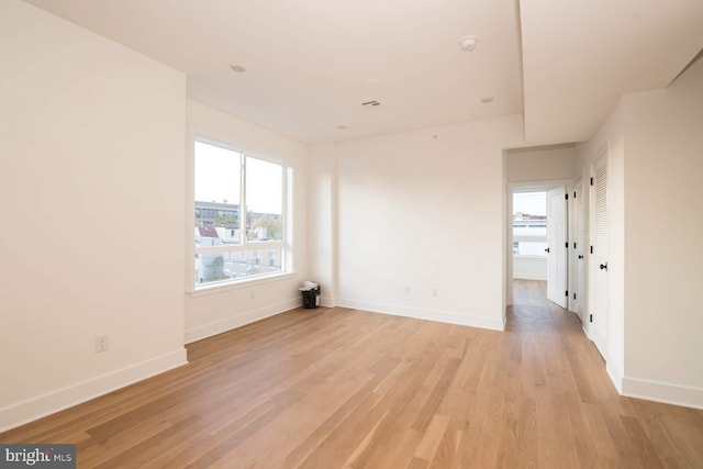 unfurnished room featuring light hardwood / wood-style flooring