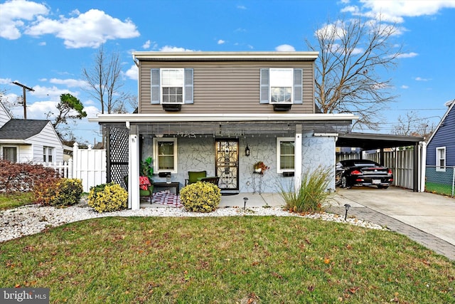 view of front property featuring a carport, a porch, and a front lawn