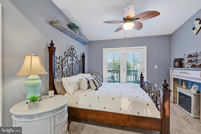 carpeted bedroom featuring ceiling fan and access to outside