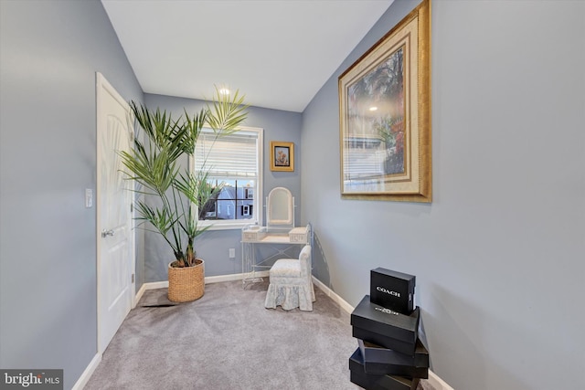 sitting room with carpet flooring and lofted ceiling